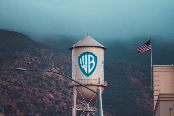 The image shows a Warner Bros. water tower with a large 