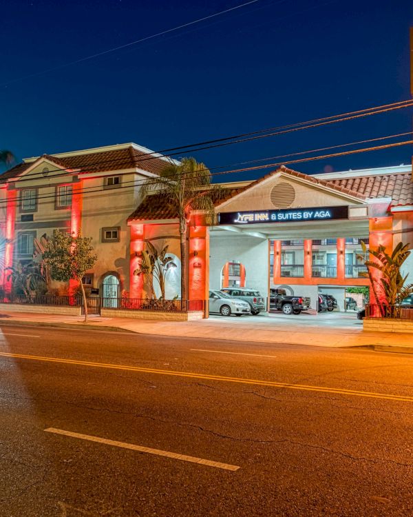 The image shows a brightly lit building with a sign reading 