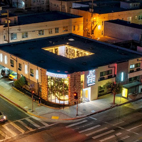 An aerial view of a well-lit building with a 